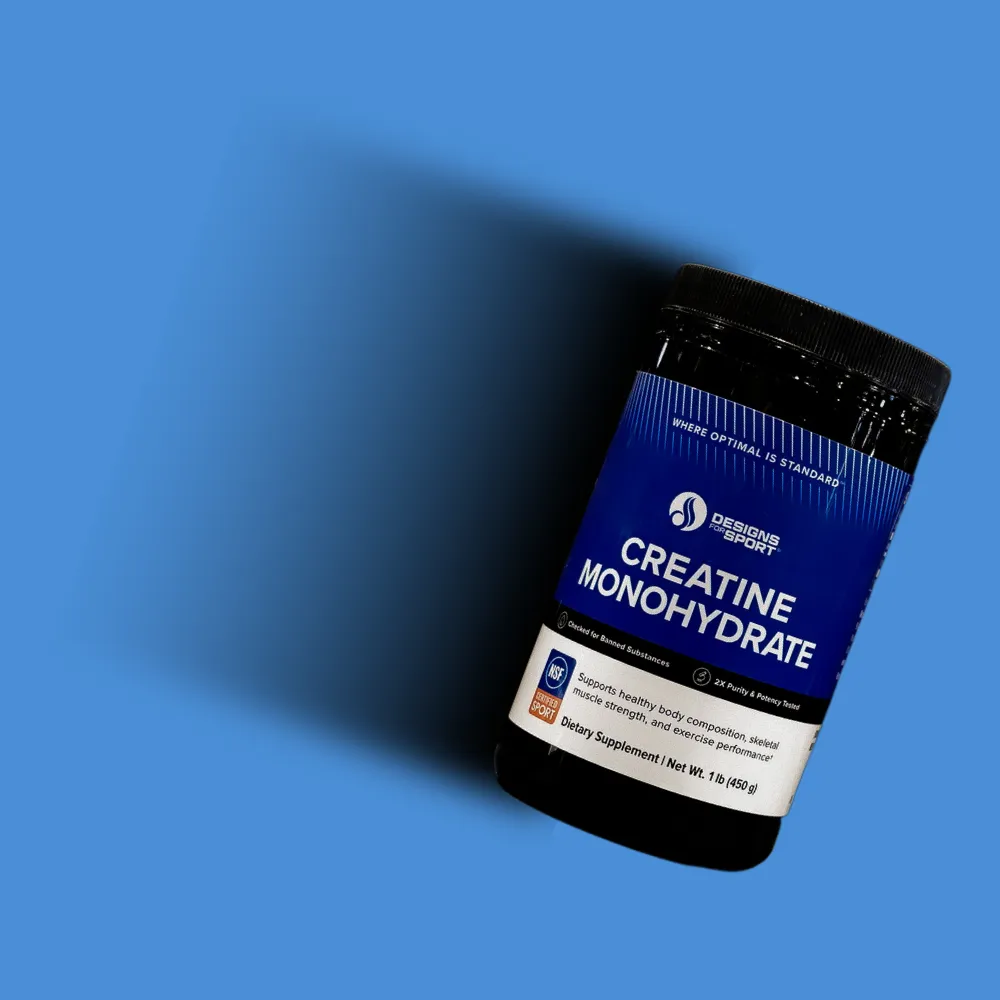 Creatine monohydrate product shot on a blue backdrop